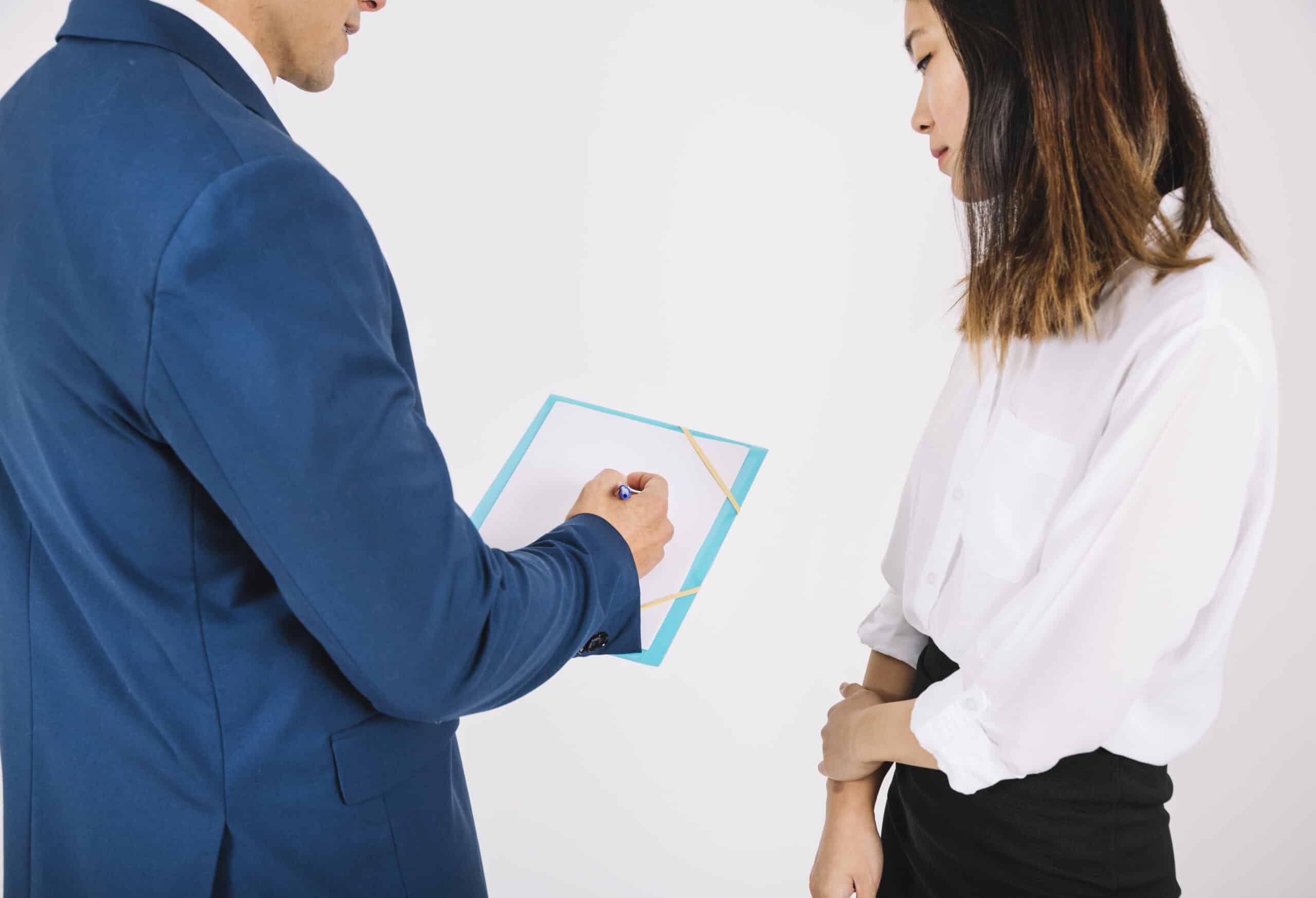 business-persons-looking-clipboard